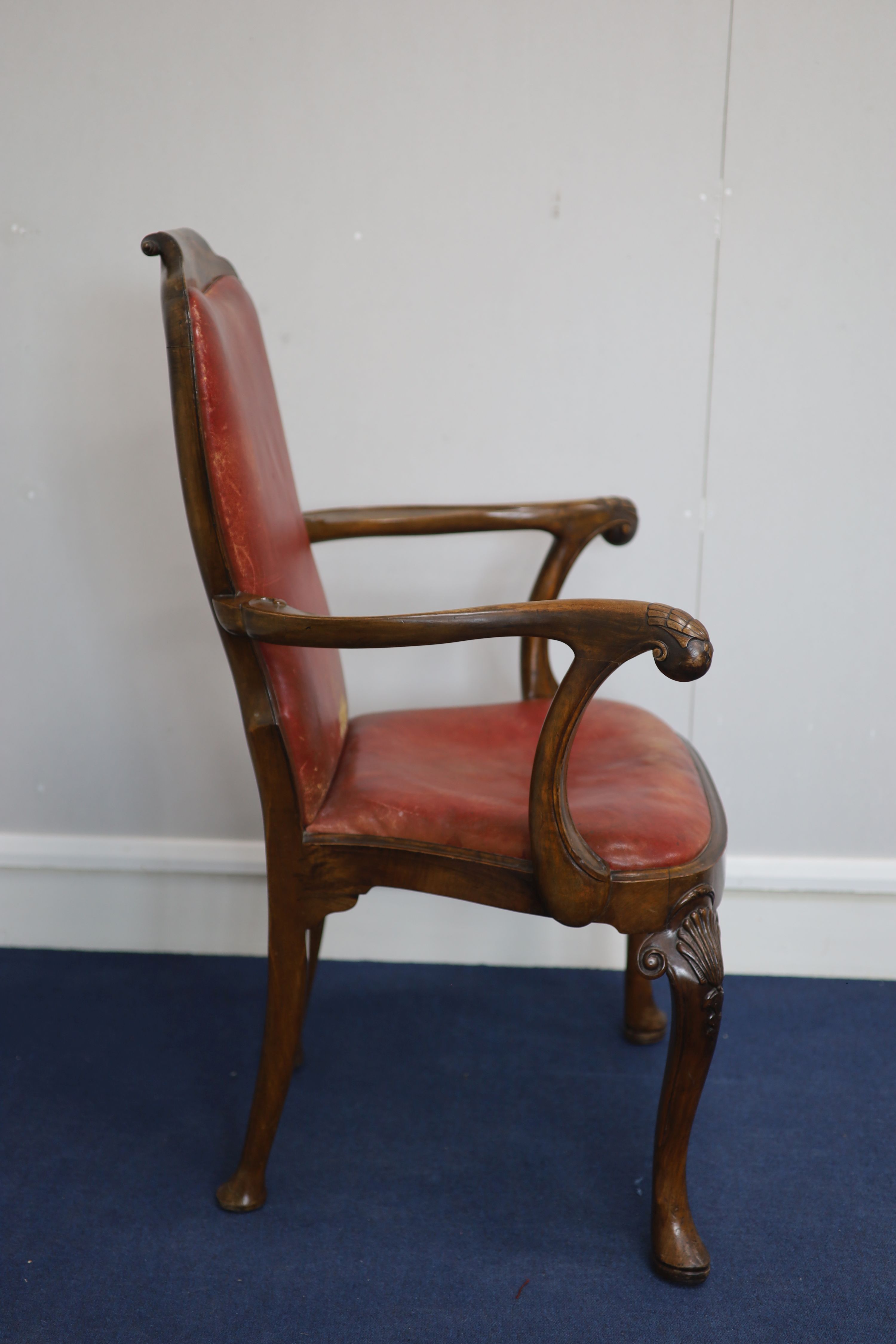 A set of four George I style walnut armchairs, first quarter 20th century,